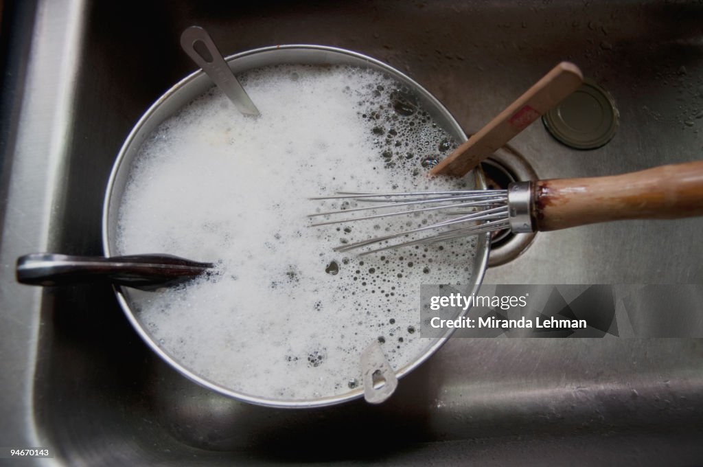 Dirty Dishes with Soap Suds