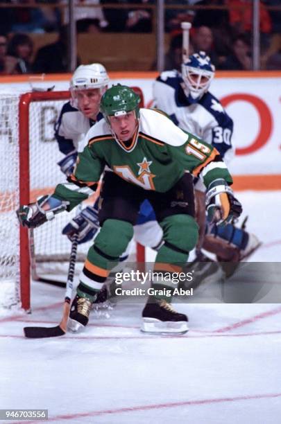 Dave Gagner of the Minnesota North Stars skates against Borje Salming and Allan Bester of the Toronto Maple Leafs during NHL game action on January...