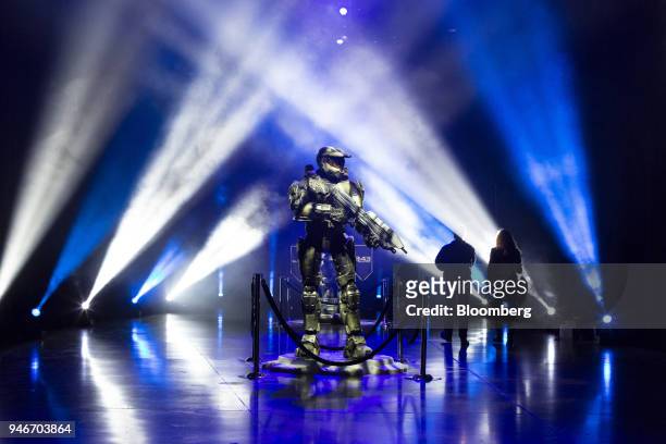 Spectators walk past a statue as they enter the Halo World Championship finals in Seattle, Washington, U.S., on Sunday, April 15, 2018. E-sports...