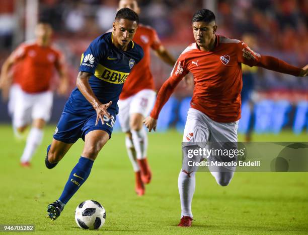 Agustin Almendra of Boca Juniors fights for the ball with Alan Franco of Independiente during a match between Independiente and Boca Juniors as part...