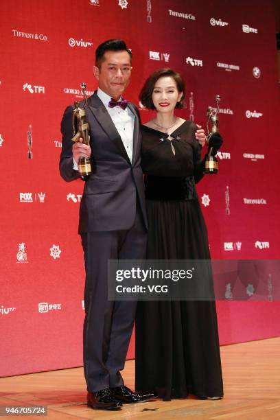Actress Teresa Mo and actor Louis Koo pose with the Best Actress and the Best Actor trophies at backstage of the 37th Hong Kong Film Awards ceremony...