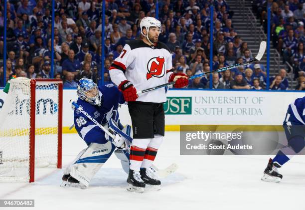 Andrei Vasilevskiy of the Tampa Bay Lightning skates against Patrick Maroon of the New Jersey Devils in Game Two of the Eastern Conference First...