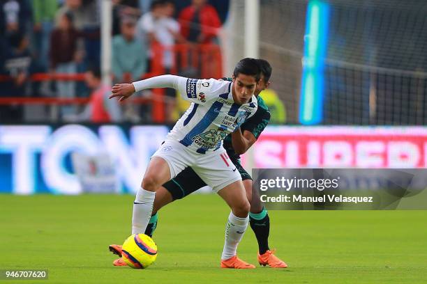 Jose Vasquez of Santos struggles for the ball against Erick Aguirre of Pachuca during the 15th round match between Pachuca and Santos Laguna as part...