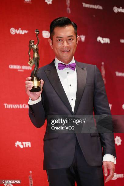 Actor Louis Koo poses with the Best Actor trophy at backstage of the 37th Hong Kong Film Awards ceremony at Hong Kong Cultural Centre on April 15,...