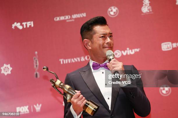 Actor Louis Koo poses with the Best Actor trophy at backstage of the 37th Hong Kong Film Awards ceremony at Hong Kong Cultural Centre on April 15,...