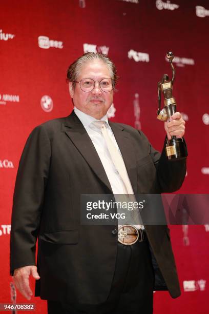 Martial artist Sammo Hung poses with the Best Action Choreography trophy at backstage of the 37th Hong Kong Film Awards ceremony at Hong Kong...