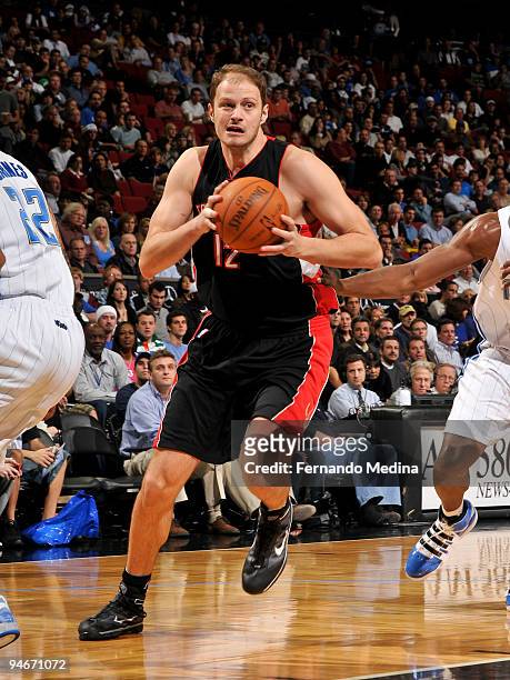 Rasho Nesterovic of the Toronto Raptors moves the ball against the Orlando Magic during the game on December 16, 2009 at Amway Arena in Orlando,...
