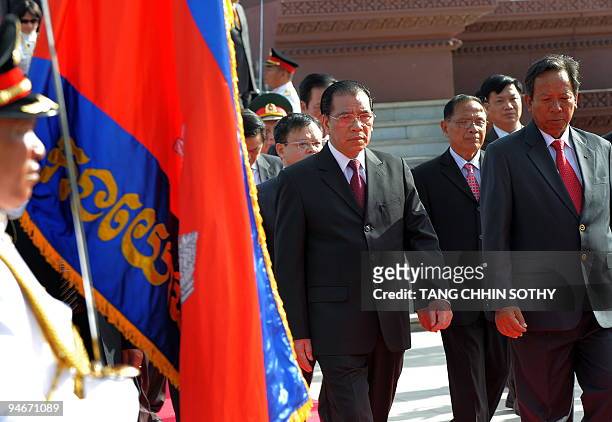 Vietnamese general Secretary of the Communist party Nong Duc Manh and Cambodian Minister of Defence Tea Banh review an honor guard at the Independent...