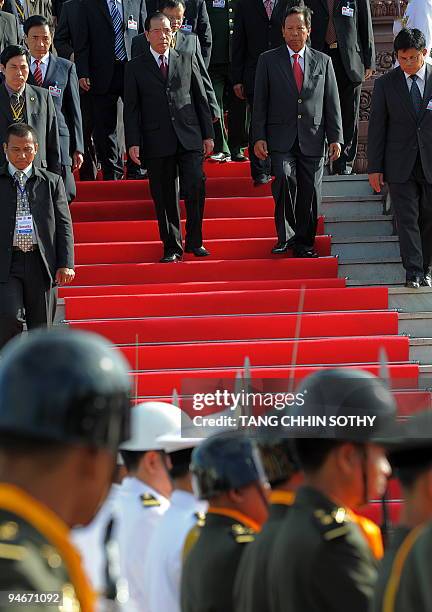 Vietnamese general Secretary of the Communist party Nong Duc Manh and Cambodian Minister of Defence Tea Banh walk down a staircase at the Independent...