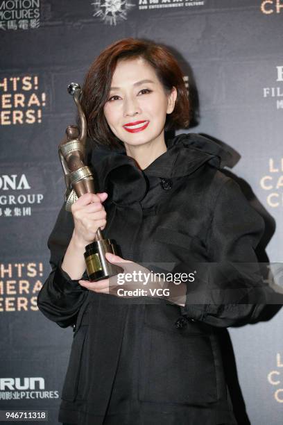 Actress Teresa Mo poses with the Best Actress award at the after party of the 37th Hong Kong Film Awards ceremony on April 15, 2018 in Hong Kong,...