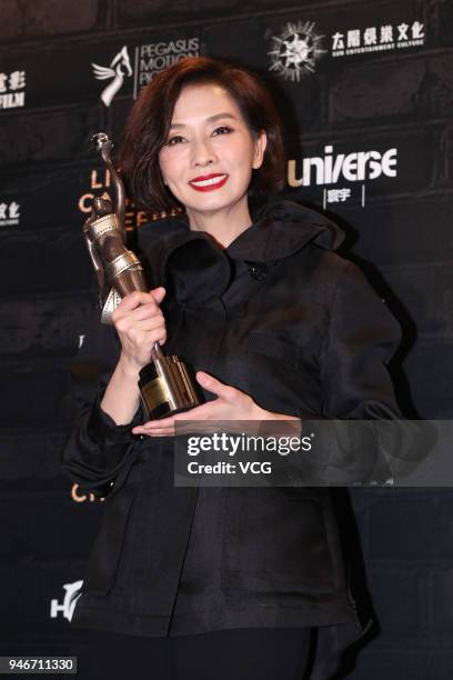 Actress Teresa Mo poses with the Best Actress award at the after party of the 37th Hong Kong Film Awards ceremony on April 15, 2018 in Hong Kong,...