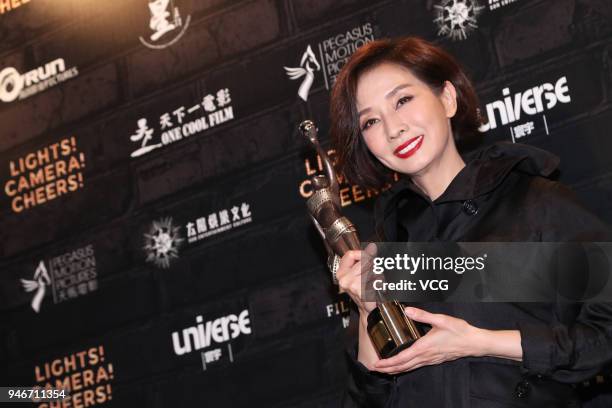 Actress Teresa Mo poses with the Best Actress award at the after party of the 37th Hong Kong Film Awards ceremony on April 15, 2018 in Hong Kong,...