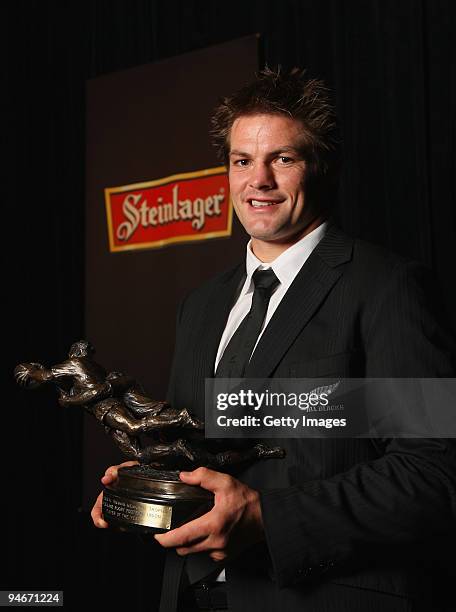 All Black Captain Richie McCaw holds the Kelvin R. Tremain Memorial Player of the Year trophy during the 2009 Steinlager New Zealand Rugby Awards at...