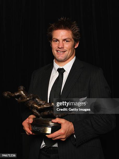 All Black Captain Richie McCaw holds the Kelvin R. Tremain Memorial Player of the Year trophy during the 2009 Steinlager New Zealand Rugby Awards at...