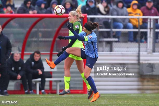 Sky Blue FC midfielder Carli Lloyd battles Seattle Reign FC midfielder Allie Long during the first half of the National Womens Soccer League game...