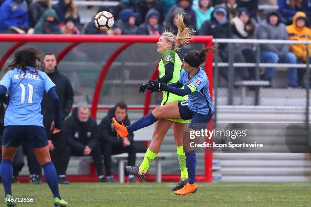 Sky Blue FC midfielder Carli Lloyd battles Seattle Reign FC midfielder Allie Long during the first half of the National Womens Soccer League game...