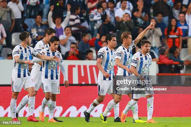 Keisuke Honda of Pachuca celebrates with teammates after scoring the first goal of his team during the 15th round match between Pachuca and Santos...