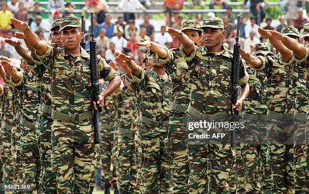 East Timorese soldiers parade during the inauguration of new members of the East Timor Defence Forces in Dili on December 17, 2009. East Timor's...