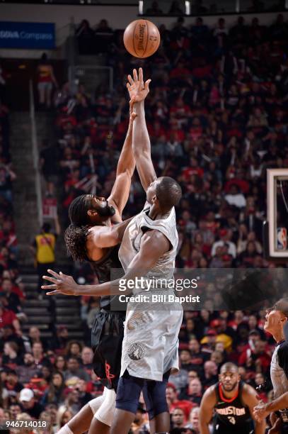 Nene Hilario of the Houston Rockets and Gorgui Dieng of the Minnesota Timberwolves jump for possession in Game One of Round One of the 2018 NBA...