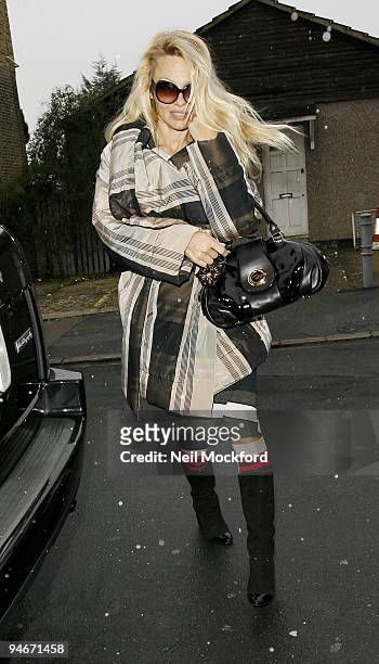 Pamela Anderson sighted arriving at the New Wimbledon Theatre for her performance as the Genie in Aladdin on December 16, 2009 in London, England.