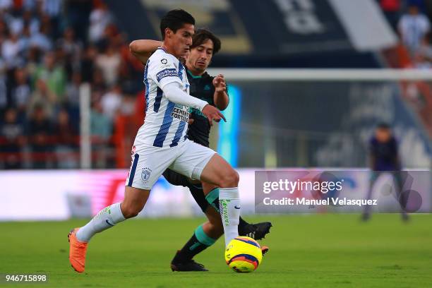 Erick Aguirre of Pachuca struggles for the ball against Jose Abella of Santos during the 15th round match between Pachuca and Santos Laguna as part...