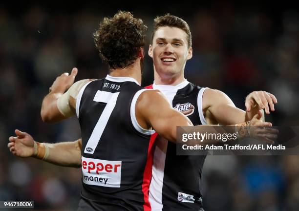 Blake Acres of the Saints congratulates Luke Dunstan of the Saints on a goal during the 2018 AFL Round 04 match between the Geelong Cats and the St...