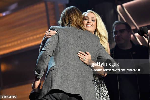 Keith Urban and Carrie Underwood accept the Vocal Event of the Year award for 'The Fighter' onstage during the 53rd Academy of Country Music Awards...
