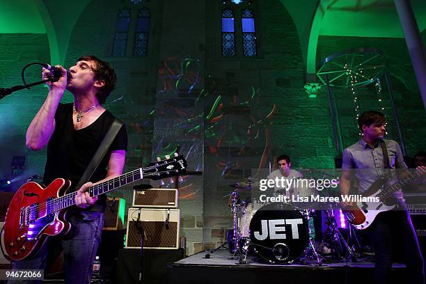 Nic Cester, Chris Cester and Mark Wilson of the band Jet performs on stage at the "Jet Live At The Chapel" concert at Paddington Uniting Church on...