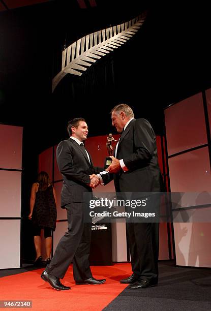 Sir Colin Meads presents Mike Delany with his trophy for Air New Zealand Cup Player of the Year during the 2009 Steinlager New Zealand Rugby Awards...