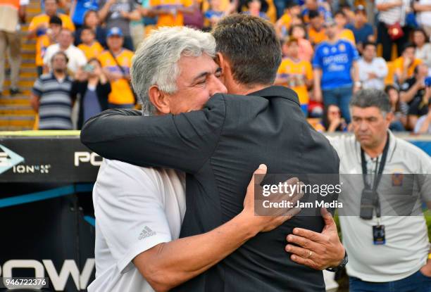Ricardo Ferretti, Coach of Tigres and Pedro Caixinha, Coach of Cruz Azul embrace each other prior the 15th round match between Tigres UANL and Cruz...