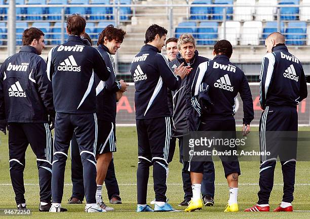 Real Madrid coach Manuel Pellegrini talks to his players during a training session at Valdebebas on December 17, 2009 in Madrid, Spain.