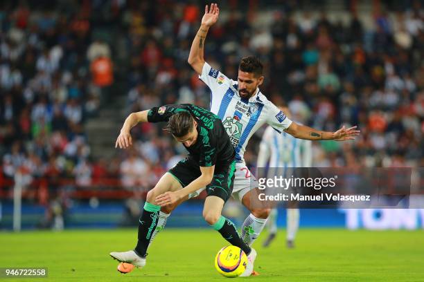 Franco Jara of Pachuca struggles for the ball against Jorge Flores of Santos during the 15th round match between Pachuca and Santos Laguna as part of...