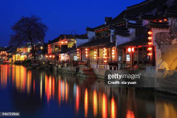 illuminated houses along canal in xitang ancient town,china - jiaxing fotografías e imágenes de stock