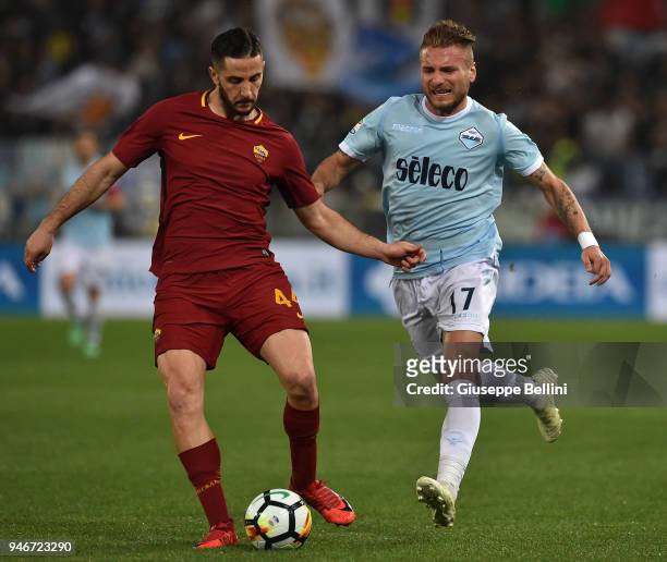 Kostas Manolas of AS Roma and Ciro Immobile of SS Lazio in action during the serie A match between SS Lazio and AS Roma at Stadio Olimpico on April...