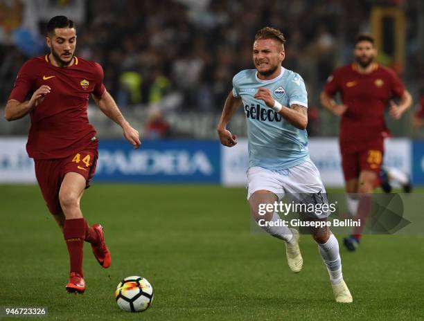 Kostas Manolas of AS Roma and Ciro Immobile of SS Lazio in action during the serie A match between SS Lazio and AS Roma at Stadio Olimpico on April...