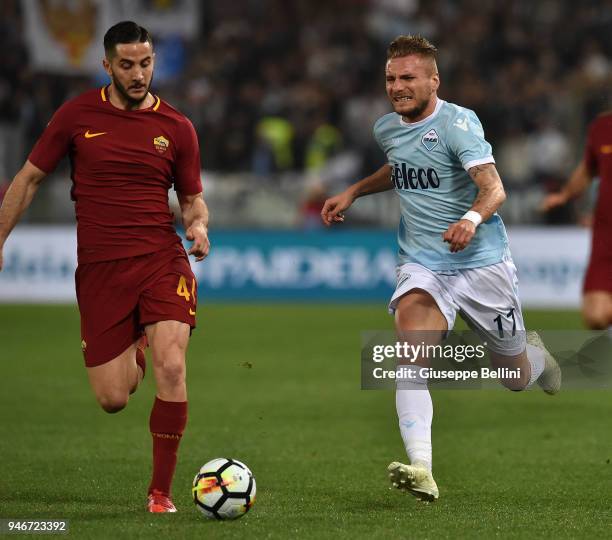 Kostas Manolas of AS Roma and Ciro Immobile of SS Lazio in action during the serie A match between SS Lazio and AS Roma at Stadio Olimpico on April...