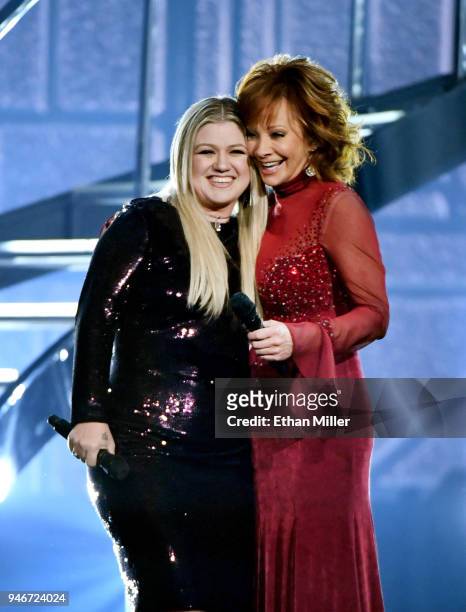 Kelly Clarkson and host Reba McEntire perform onstage during the 53rd Academy of Country Music Awards at MGM Grand Garden Arena on April 15, 2018 in...