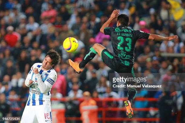 Jorge Hernandez of Pachuca struggles for the ball against Jose Vasquez of Santos during the 15th round match between Pachuca and Santos Laguna as...
