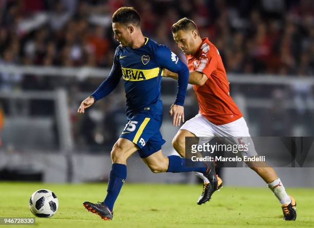 Nahitan Nandez of Boca Juniors fights for the ball with Nicolas Domingo of Independiente during a match between Independiente and Boca Juniors as...