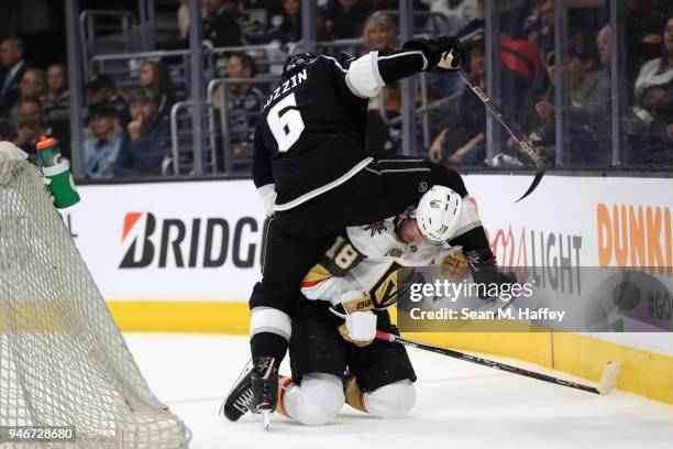 Jake Muzzin of the Los Angeles Kings leaps over James Neal of the Vegas Golden Knights during the first period in Game Three of the Western...