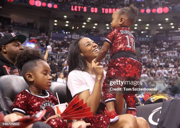 Kiara Morrison the wife of DeMar DeRozan of the Toronto Raptors with the couple"u2019s two daughters during the game against the Washington Wizards...