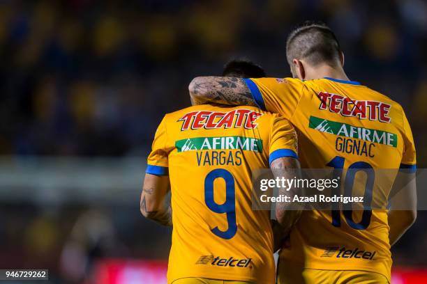 Eduardo Vargas of Tigres celebrates with teammate Andre-Pierre Gignac after scoring his team's second goal during the 15th round match between Tigres...