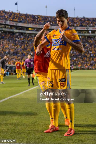 Jurgen Damm of Tigres celebrates with teammates after scoring his team's first goal during the 15th round match between Tigres UANL and Cruz Azul as...