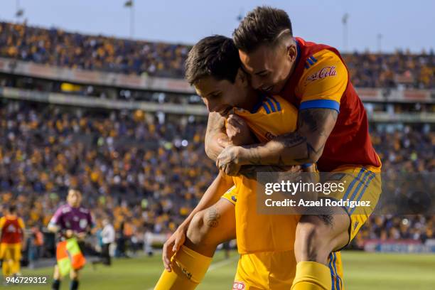 Jurgen Damm of Tigres celebrates with teammates after scoring his team's first goal during the 15th round match between Tigres UANL and Cruz Azul as...