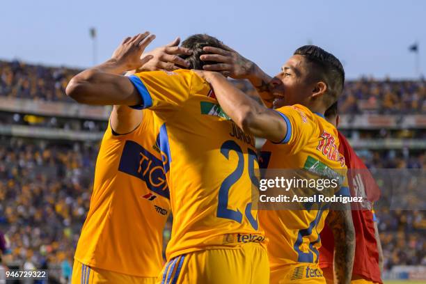 Jurgen Damm of Tigres celebrates with teammates after scoring his team's first goal during the 15th round match between Tigres UANL and Cruz Azul as...