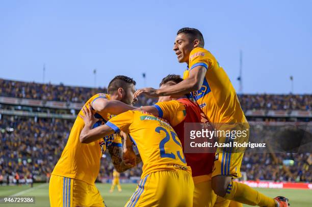 Jurgen Damm of Tigres celebrates with teammates after scoring his team's first goal during the 15th round match between Tigres UANL and Cruz Azul as...
