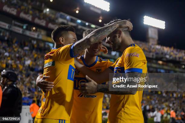 Eduardo Vargas of Tigres celebrates with teammates Jurgen Damm and Andre-Pierre Gignac after scoring his team"u2019s second goal during the 15th...