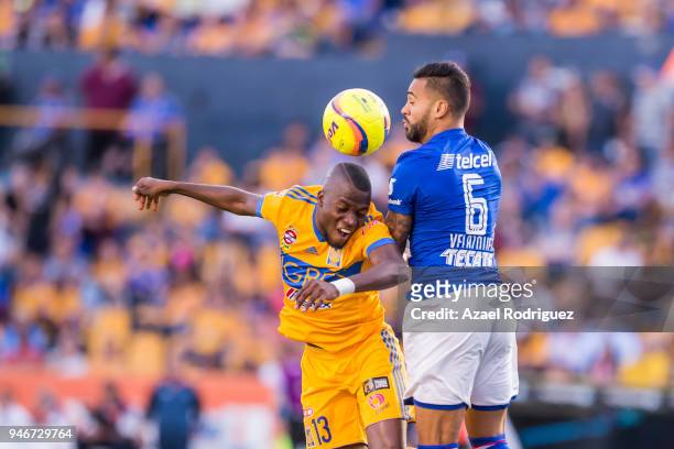 Enner Valencia of Tigres fights for the ball with Julian Velazquez of Cruz Azul during the 15th round match between Tigres UANL and Cruz Azul as part...