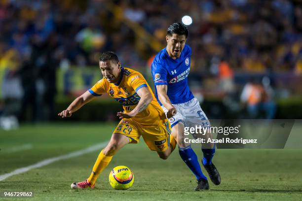 Jesus Duenas of Tigres fights for the ball with Francisco Silva of Cruz Azul during the 15th round match between Tigres UANL and Cruz Azul as part of...