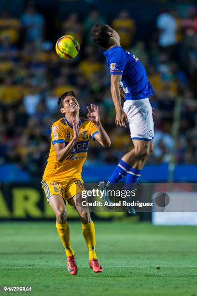 Jurgen Damm of Tigres observes as Julio Dominguez of Cruz Azul heads the ball during the 15th round match between Tigres UANL and Cruz Azul as part...